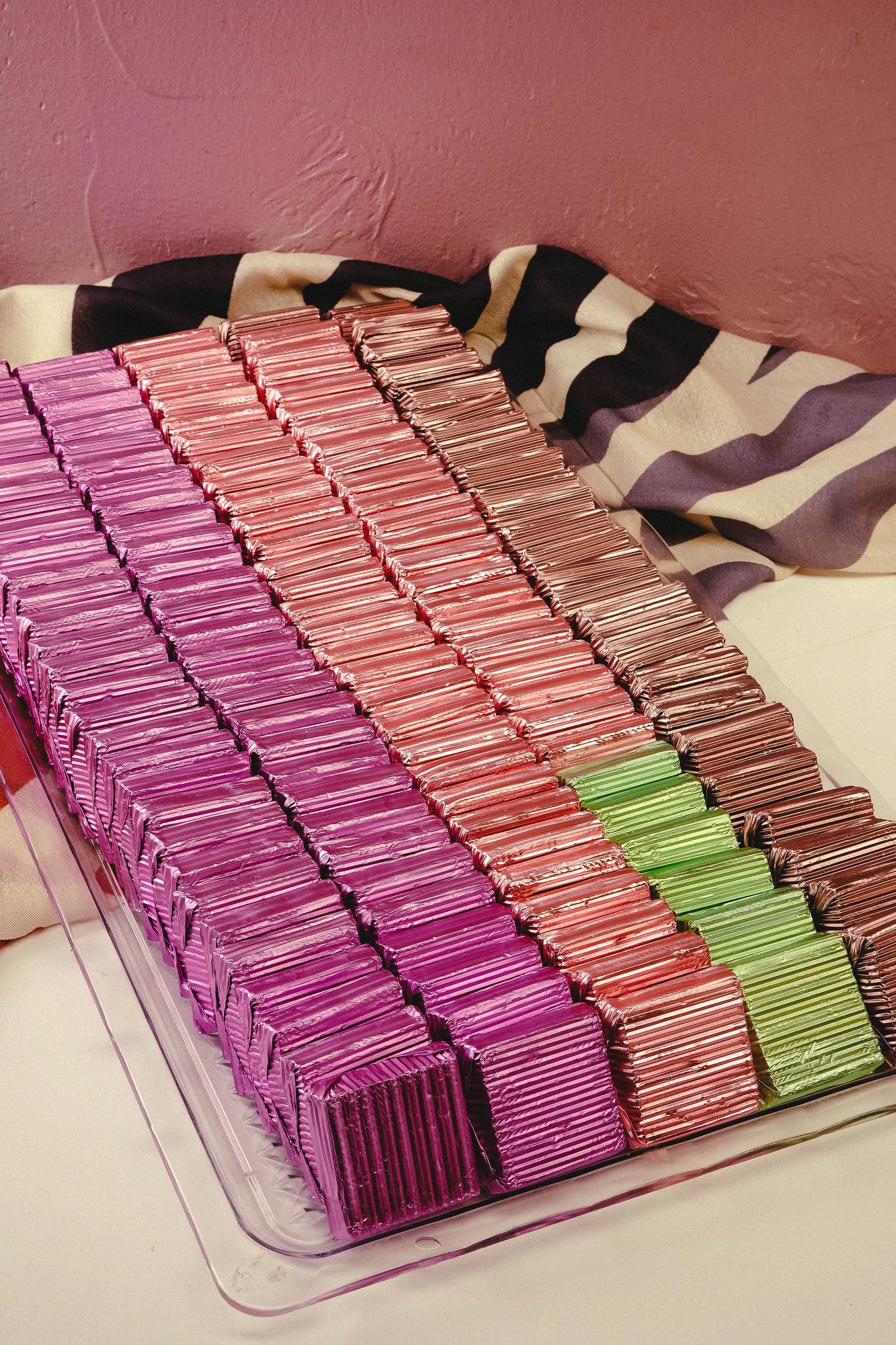 Stack of embroidered swatches labeled with stitch types
